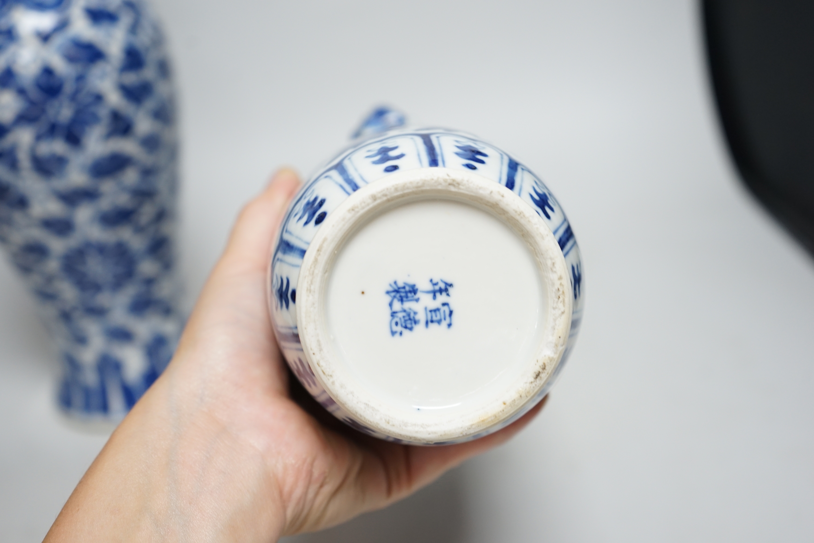 A late 19th century Chinese blue and white 'Lotus' vase and cover and another similar (2), tallest 31cm